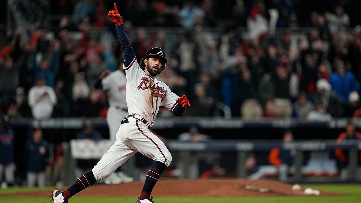 Atlanta Braves' Dansby Swanson celebrates his home run during the seventh inning in Game 4 of the World Series against the Houston Astros on Saturday, Oct. 30, 2021, in Atlanta.