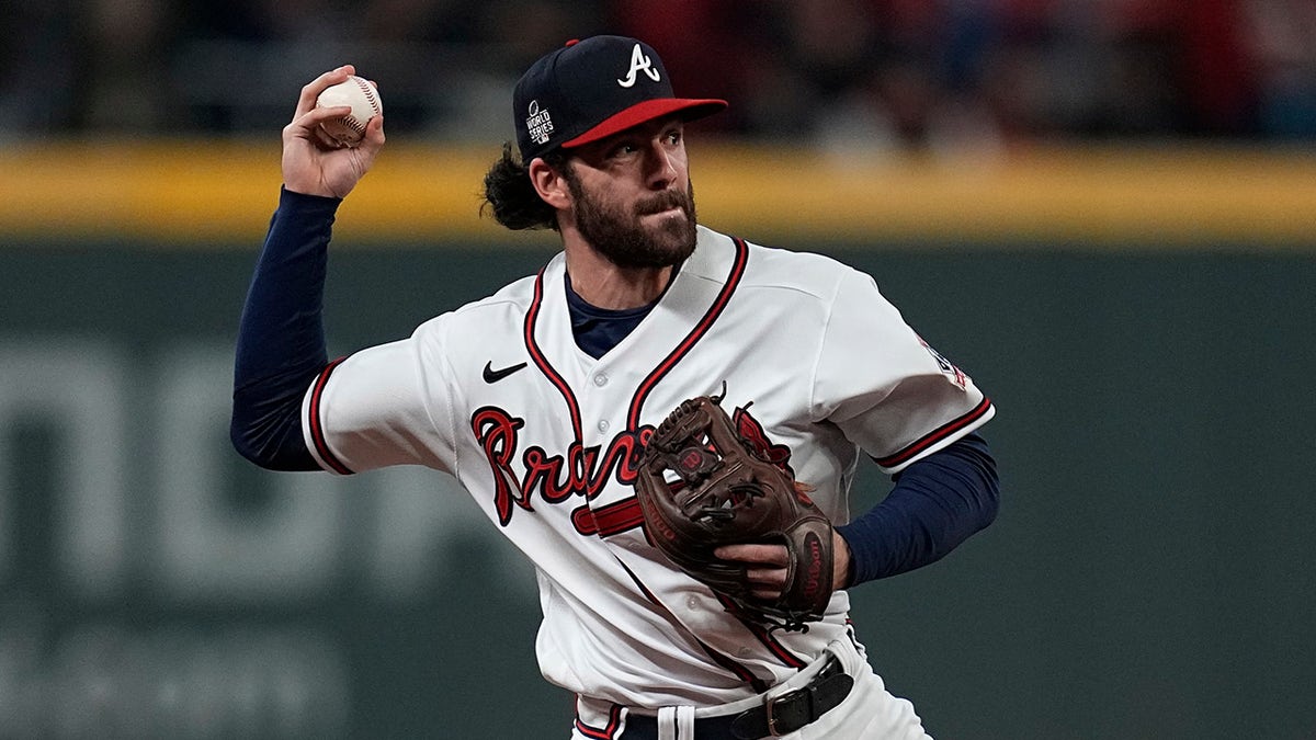 Atlanta Braves shortstop Dansby Swanson fields a base hit by Houston Astros' Jose Altuve during the first inning in Game 4 of the World Series Saturday, Oct. 30, 2021, in Atlanta.