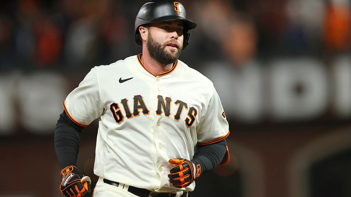 San Francisco Giants' Darin Ruf rounds the bases after hitting a home run against the Los Angeles Dodgers during the sixth inning of Game 5 of a baseball National League Division Series Thursday, Oct. 14, 2021, in San Francisco.