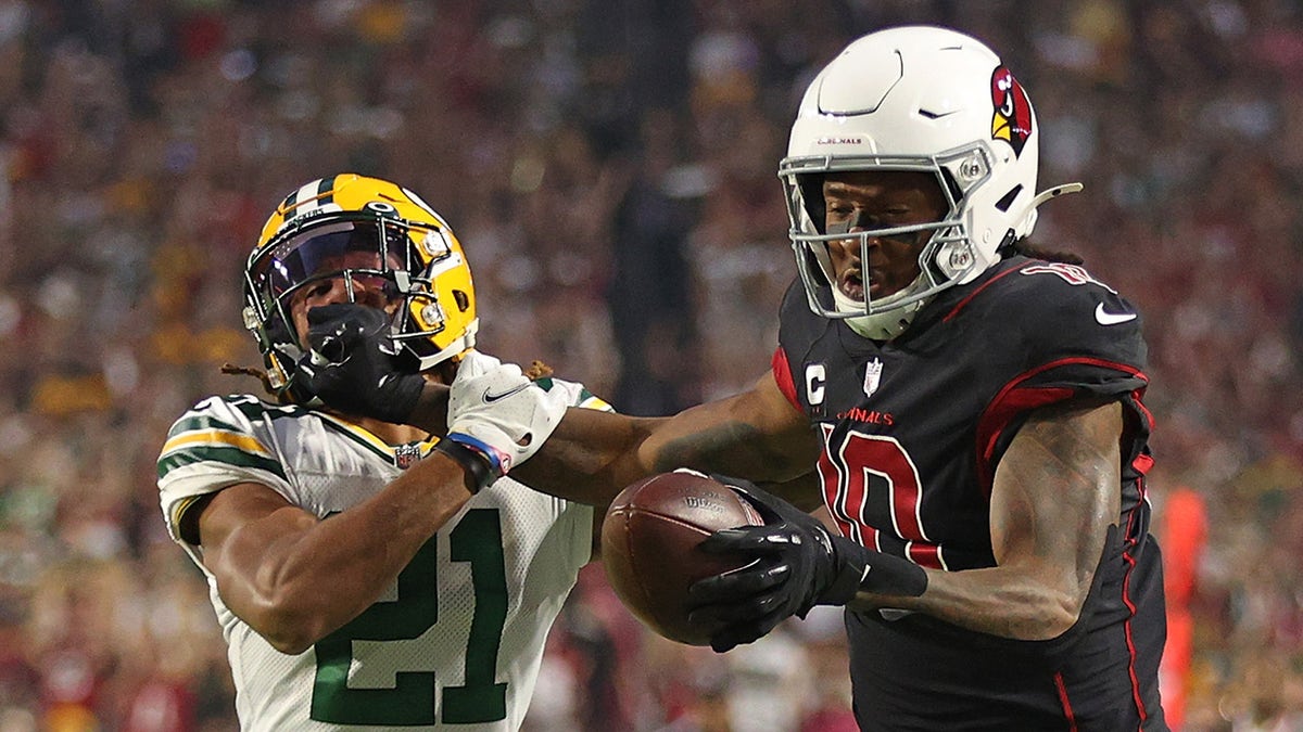 DeAndre Hopkins #10 of the Arizona Cardinals is called for a personal foul penalty against Eric Stokes #21 of the Green Bay Packers during the first half at State Farm Stadium on Oct. 28, 2021 in Glendale, Arizona.