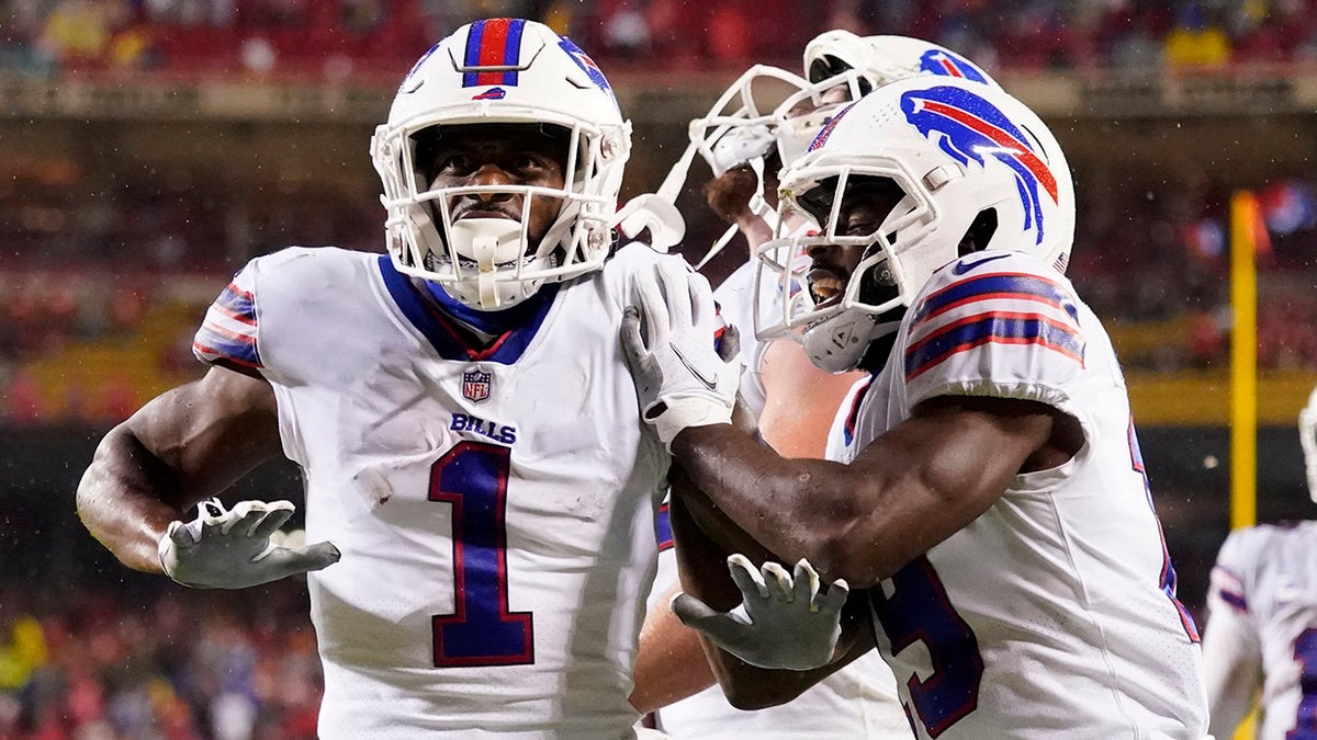 Buffalo Bills wide receiver Emmanuel Sanders (1) is congratulated by Tremaine Edmunds, right, after scoring during the second half of an NFL football game against the Kansas City Chiefs Sunday, Oct. 10, 2021, in Kansas City, Mo.