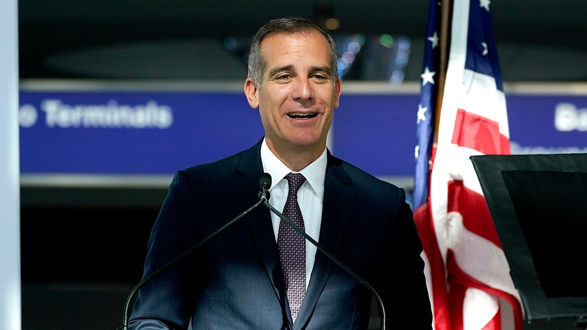 Los Angeles Mayor Eric Garcetti speaks a press conference at the new West Gates at Tom Bradley International Terminal at Los Angeles International Airport Monday, May 24, 2021. (AP Photo/Ashley Landis)