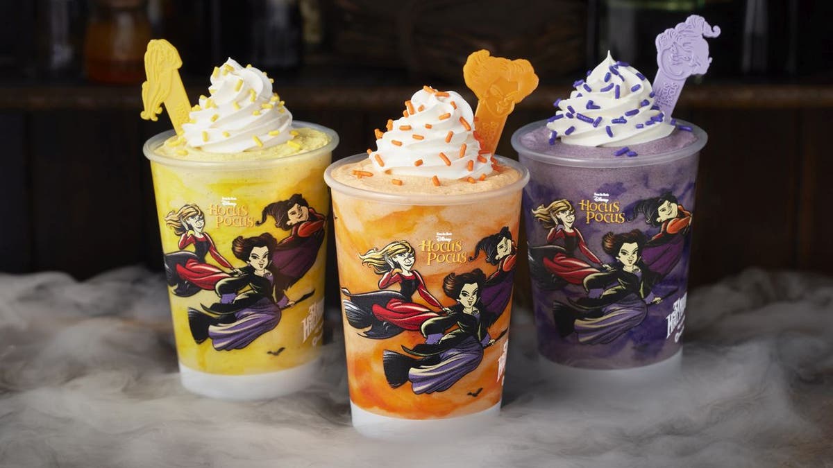 Carvel's "Hocus Pocus" milkshake trio includes Sarah’s Chilling Churro Shake (yellow), Winnie's Glorious Cake Batter Shake (orange) and Mary’s Divine Cookies & Cream Shake (purple).