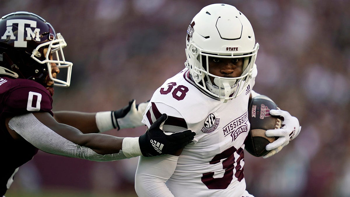 Mississippi State safety Fred Peters (38) gets by Texas A;M wide receiver Ainias Smith (0) after an interception during the first quarter of an NCAA college football game, Saturday, Oct. 2, 2021, in College Station, Texas.