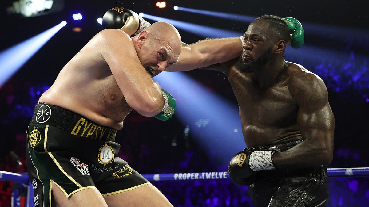Deontay Wilder punches Tyson Fury during their Heavyweight bout for Wilder's WBC and Fury's lineal heavyweight title on Feb. 22, 2020 at MGM Grand Garden Arena in Las Vegas.