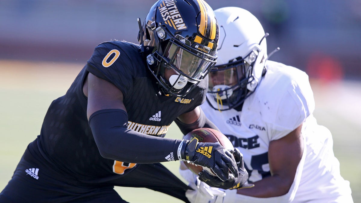 Oct 31, 2020; Hattiesburg, Mississippi, USA; Southern Miss Golden Eagles wide receiver Demarcus Jones (0) runs the ball against Rice Owls defensive back Gabe Taylor (26) in the second quarter at M.M. Roberts Stadium.
