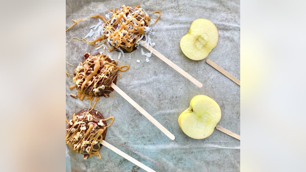 The honey crisp apple slices should look similar to cake pops when you're done.