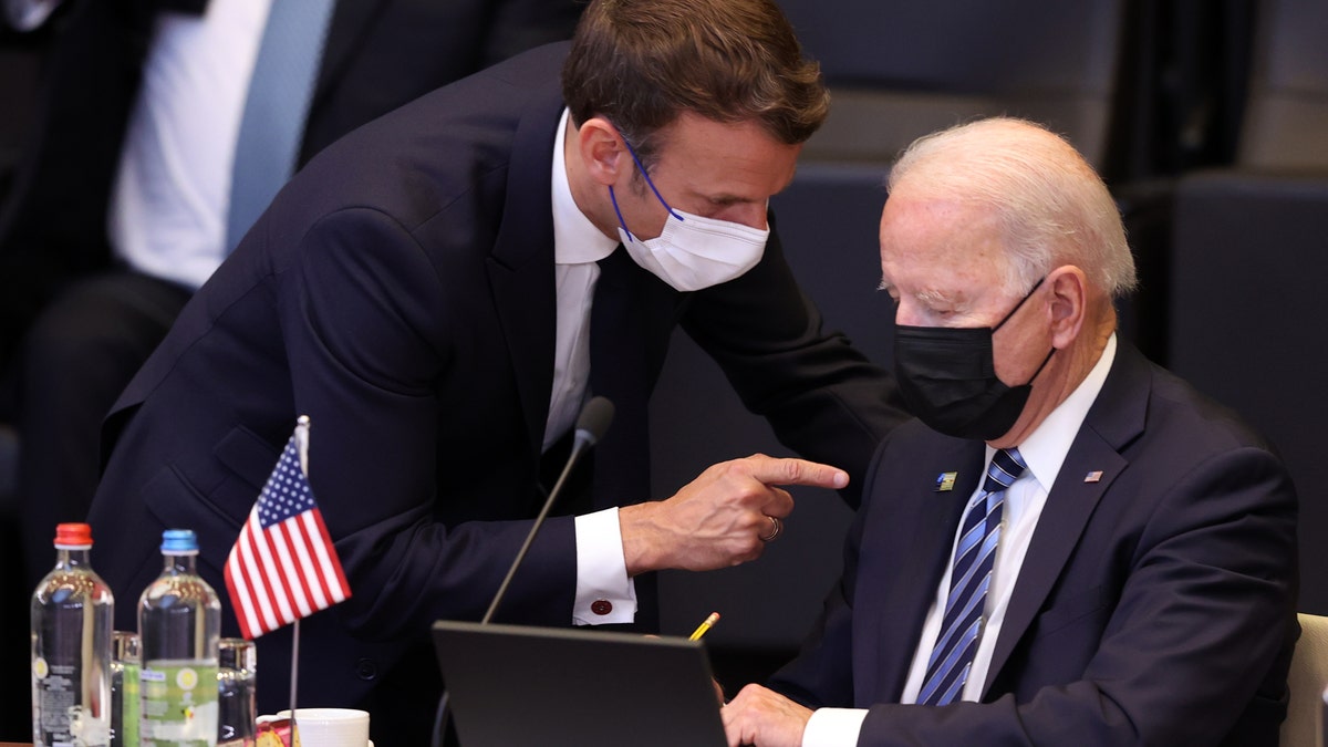 BRUSSELS, BELGIUM - JUNE 14: US President Joe Biden (R) and French President Emmanuel Macron (L) have a conversation ahead of the NATO summit at the North Atlantic Treaty Organization (NATO) headquarters in Brussels, on June 14, 2021.
