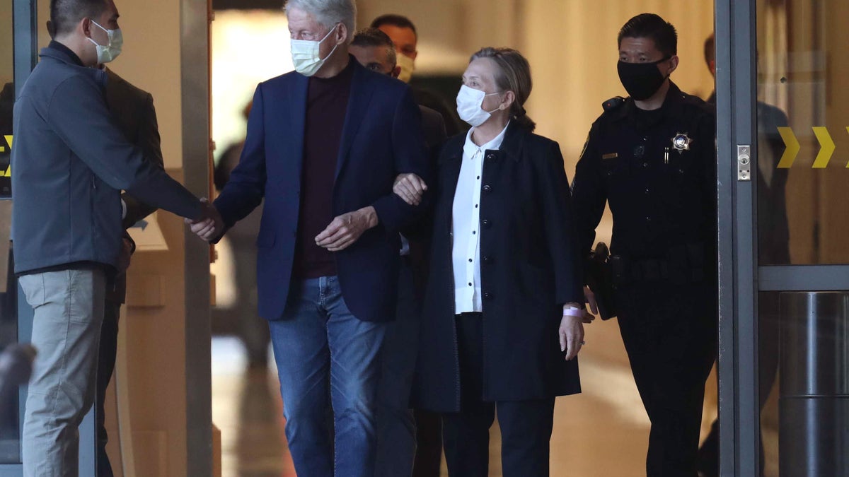 ORANGE CA OCTOBER 17, 2021 - Former President Bill Clinton, standing with his wife, Hillary, was discharged from UC Irvine Medical Center Sunday morning. (Allen J. Schaben / Los Angeles Times via Getty Images)