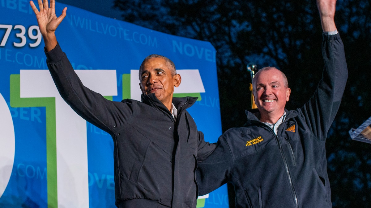 NEWARK, NJ - OCTOBER 23: Former U.S. President Barack Obama (L) and New Jersey Governor Phil Governor Murphy wave at attendees after taking part in an early vote rally on October 23, 2021 in Newark, New Jersey. People are heading to the polls in New Jersey for early voting as Murphy faces Republican challenger Jack Ciattarelli. (Photo by Eduardo Munoz Alvarez/Getty Images)