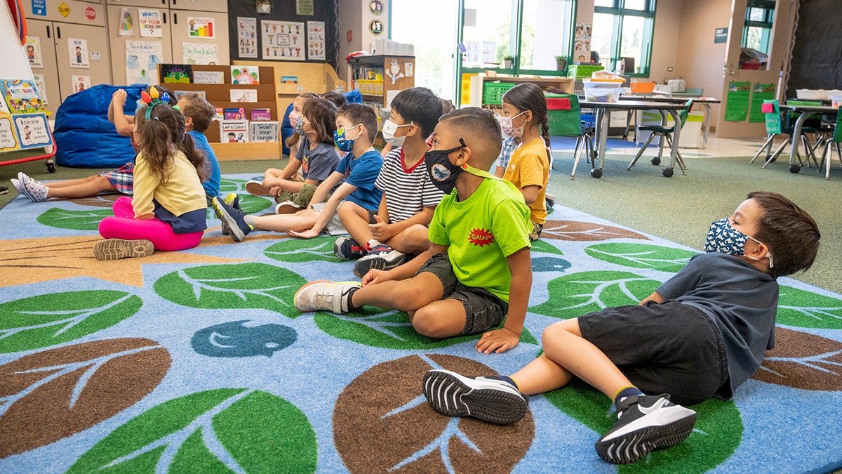 August 11: Students listen to their teacher during their first day of  transitional kindergarten class at Tustin Ranch Elementary School in Tustin, CA. (Photo by Paul Bersebach/MediaNews Group/Orange County Register via Getty Images)