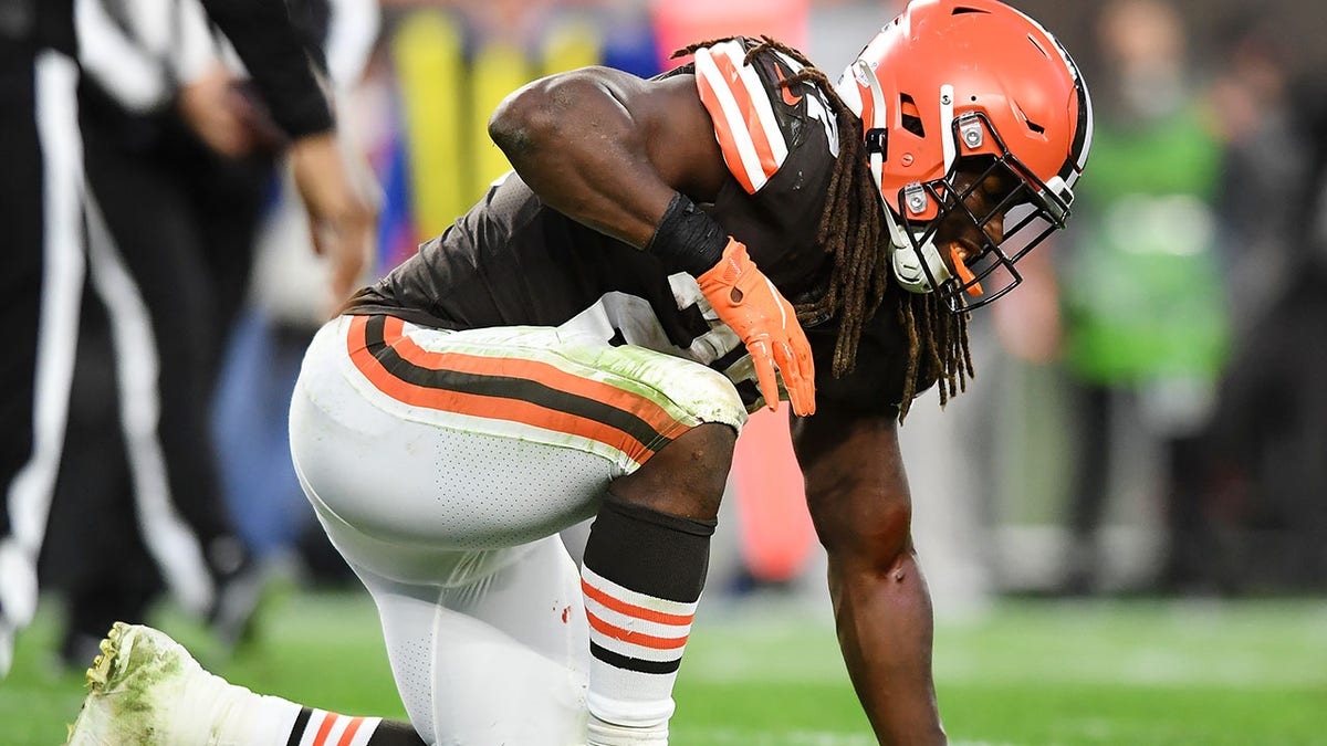CLEVELAND, OHIO - OCTOBER 17: Kareem Hunt #27 of the Cleveland Browns kneels after an injury on the field during the fourth quarter of the game against the Arizona Cardinals at FirstEnergy Stadium on October 17, 2021 in Cleveland, Ohio. (Photo by Nick Cammett/Getty Images)