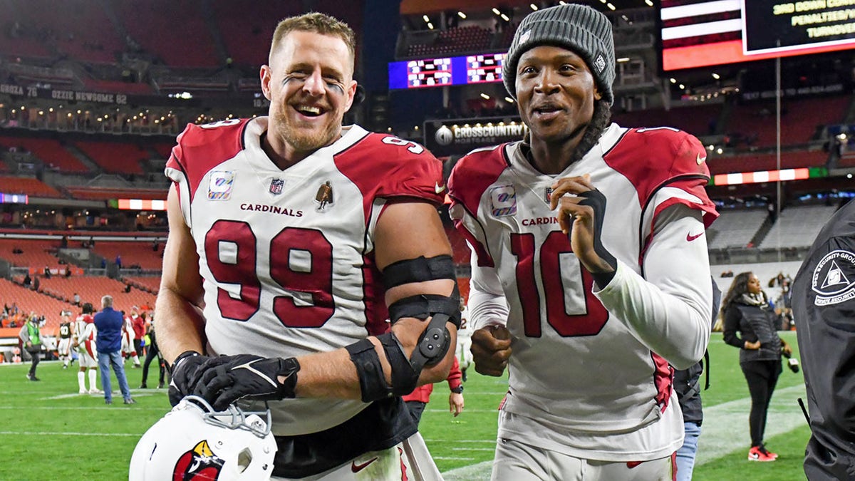 CLEVELAND, OH - OCTOBER 17: J.J. Watt #99 and DeAndre Hopkins #10 of the Arizona Cardinals react after a 37-14 win against the Cleveland Browns at FirstEnergy Stadium on October 17, 2021 in Cleveland, Ohio.