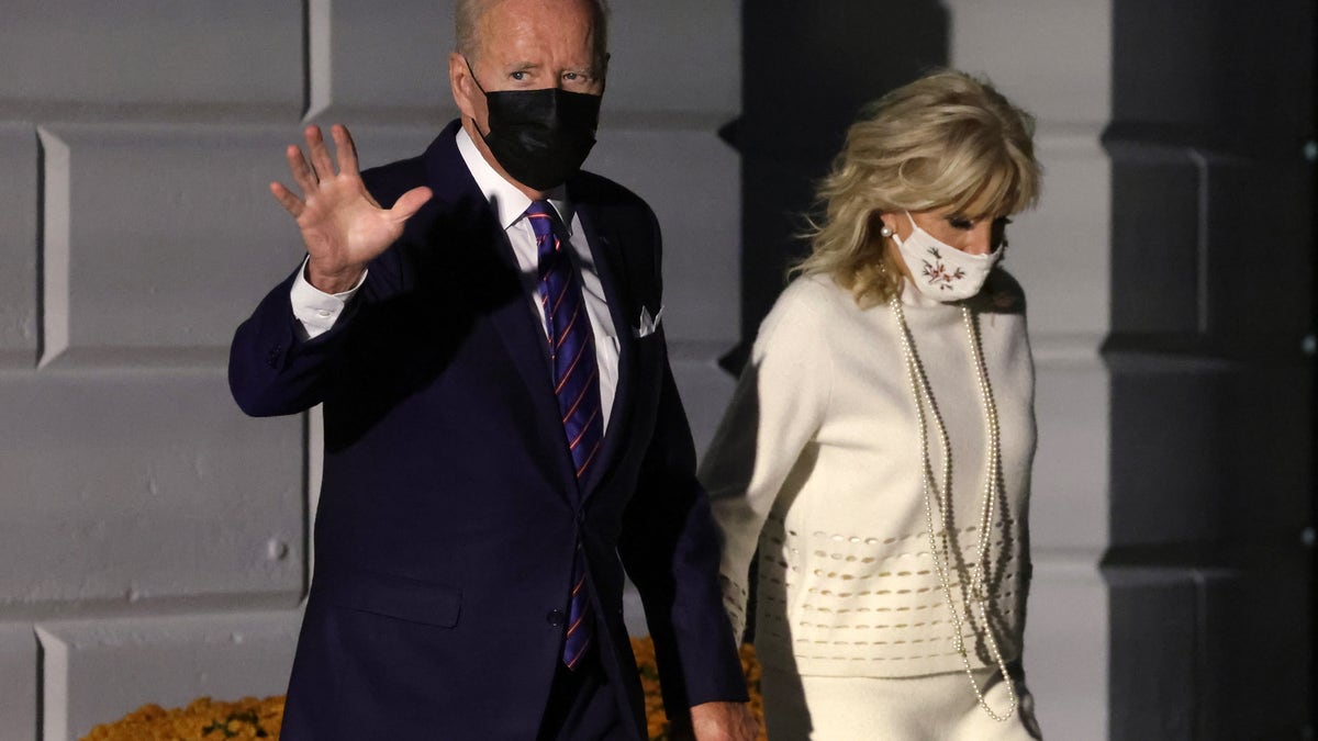 WASHINGTON, DC - OCTOBER 21: U.S. President Joe Biden walks with first lady Jill Biden prior to a Marine One departure for Baltimore, Maryland, October 21, 2021 at the White House in Washington, DC. President Biden is scheduled to participate in a town hall in Baltimore where he will discuss the Bipartisan Infrastructure Deal and Build Back Better agenda with Americans. (Photo by Alex Wong/Getty Images)
