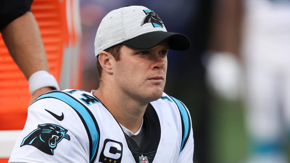 Sam Darnold #14 of the Carolina Panthers reacts on the bench during the second half in the game against the New York Giants at MetLife Stadium on October 24, 2021 in East Rutherford, New Jersey.