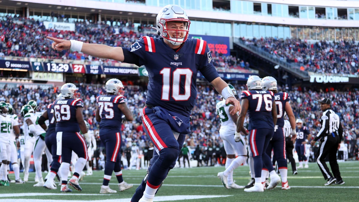 Mac Jones #10 of the New England Patriots celebrates a touchdown in the second half against the New York Jets at Gillette Stadium on October 24, 2021 in Foxborough, Massachusetts. (Photo by Maddie Meyer/Getty Images)