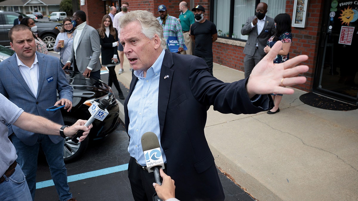 VIRGINIA BEACH, VIRGINIA - OCTOBER 25: Democratic gubernatorial candidate, former Virginia Gov. Terry McAuliffe answers questions from reporters after speaking during a campaign event where he received the endorsement of the Virginia Beach African American Political Action Council at The Happy Cafe on October 25, 2021 in Virginia Beach, Virginia. The Virginia gubernatorial election, pitting McAuliffe against Republican candidate Glenn Youngkin, is November 2.  (Photo by Win McNamee/Getty Images)