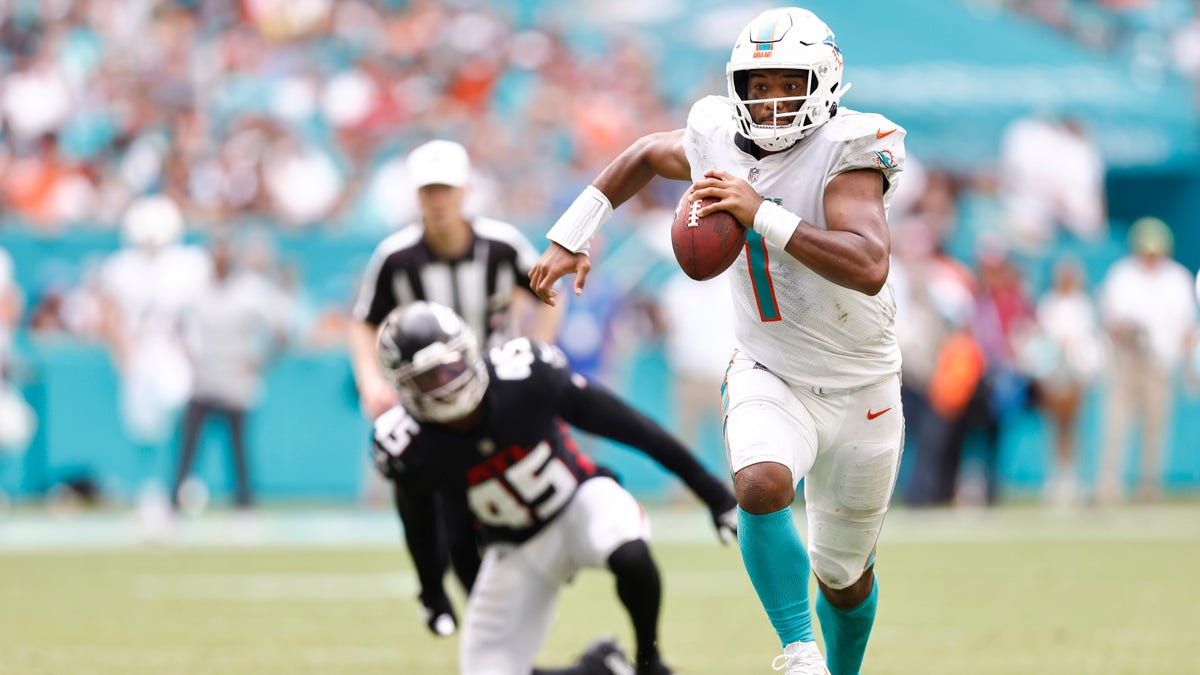 Tua Tagovailoa #1 of the Miami Dolphins scrambles with the ball against the Atlanta Falcons during the fourth quarter at Hard Rock Stadium on Oct. 24, 2021 in Miami Gardens, Florida.