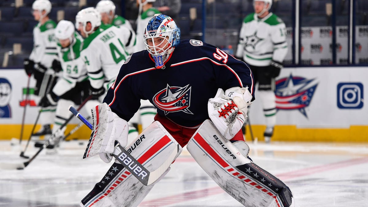 COLUMBUS, OH - OCTOBER 25: Goaltender Elvis Merzlikins #90 of the Columbus Blue Jackets warms up prior to a game against the Dallas Stars at Nationwide Arena on October 25, 2021 in Columbus, Ohio.  (Photo by Ben Jackson/NHLI via Getty Images)