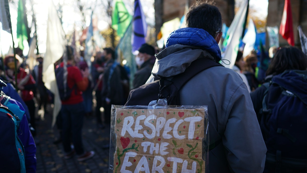 GLASGOW, SCOTLAND - OCTOBER 30: Pilgrimage groups who have walked to Glasgow are joined by members of the group, Extinction Rebellion as they walk to raise awareness of the climate crisis on October 30, 2021 in Glasgow, Scotland. 
