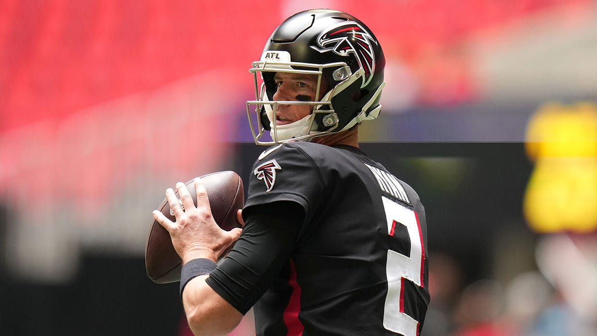 Matt Ryan warms up before the Falcons' game against the Carolina Panthers at Mercedes-Benz Stadium on Oct. 31, 2021, in Atlanta, Georgia.