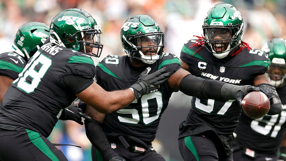 Shaq Lawson (50) of the New York Jets celebrates after making an interception during the fourth quarter against the Cincinnati Bengals at MetLife Stadium Oct. 31, 2021 in East Rutherford, N.J. 