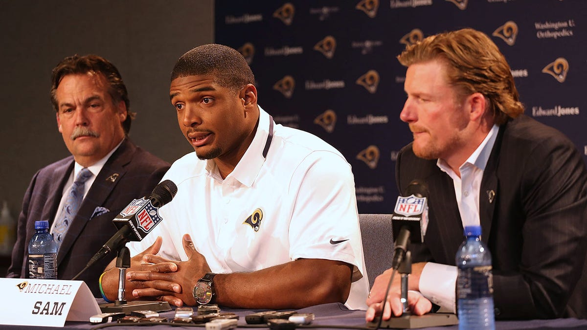 EARTH CITY, MO - MAY 13: (L to R) St. Louis Rams head coach Jeff Fischer, draft pick Michael Sam and general manager Les Snead address the media during a press conference at Rams Park on May 13, 2014 in Earth City, Missouri.  (Photo by Dilip Vishwanat/Getty Images)