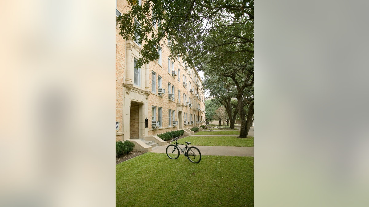 Bicycle in front of a dorm on the campus of theTexas A&M University on November 24, 2005 in College Station, Texas. (Photo by Wesley Hitt/Getty Images)