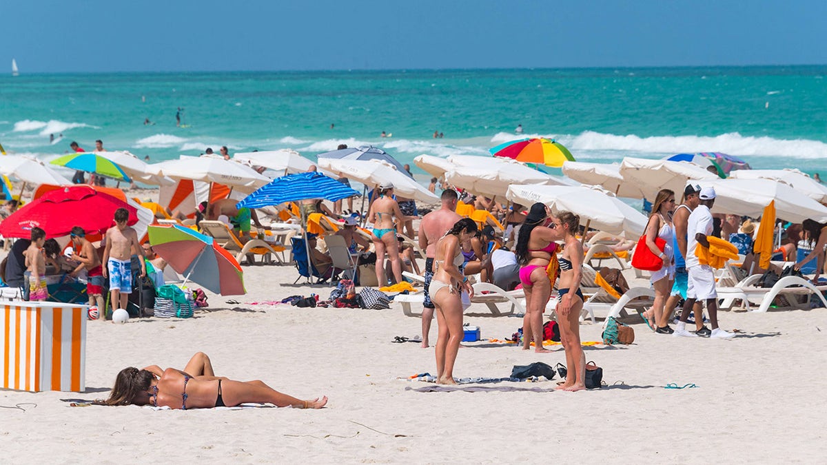 MIAMI, FLORIDA, UNITED STATES - 2017/04/30: Miami beach crowd on a Sunday. The beach is a major tourist attraction in Florida city.