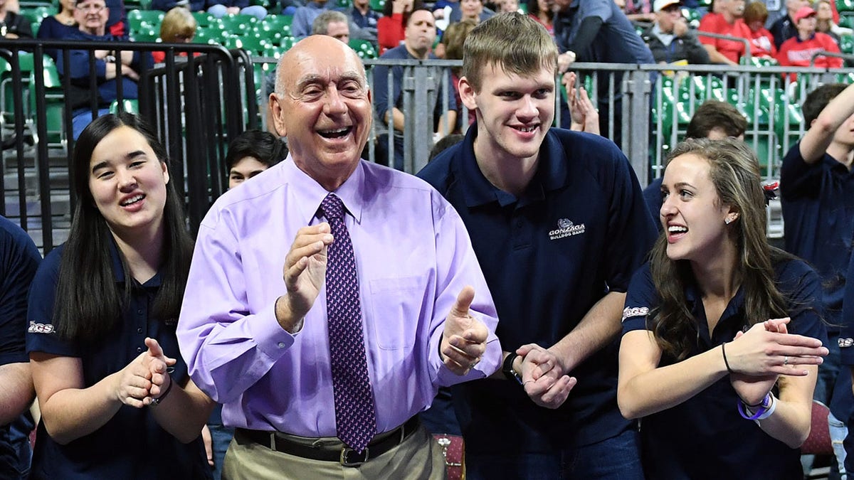 Sportscaster Dick Vitale (2nd L) dances with members of the Gonzaga Bulldogs band before the championship game of the West Coast Conference basketball tournament between the Bulldogs and the Brigham Young Cougars at the Orleans Arena on March 6, 2018 in Las Vegas, Nevada. The Bulldogs won 74-54. 