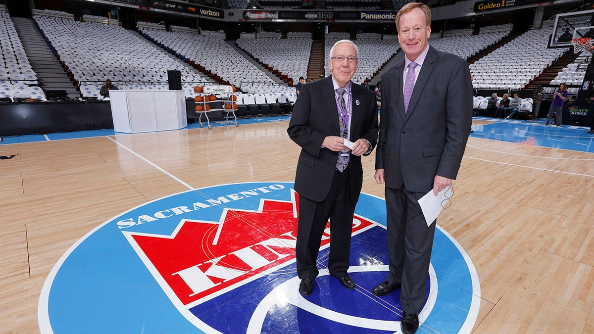 SACRAMENTO, CA - APRIL 9: American sportscaster Gary Gerould and Sacramento Kings broadcaster Grant Napear pose for a photo in front othe Sacramento Kings logo prior to the game against the Oklahoma City Thunder on April 9, 2016 at Sleep Train Arena in Sacramento, California.