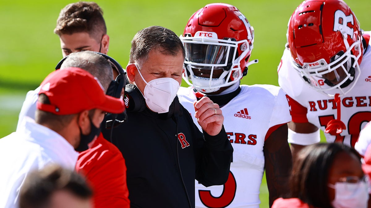 Head coach Greg Schiano of the Rutgers Scarlet Knights talks to his team during a game against the Michigan State Spartans at Spartan Stadium on Oct. 24, 2020 in East Lansing, Michigan.