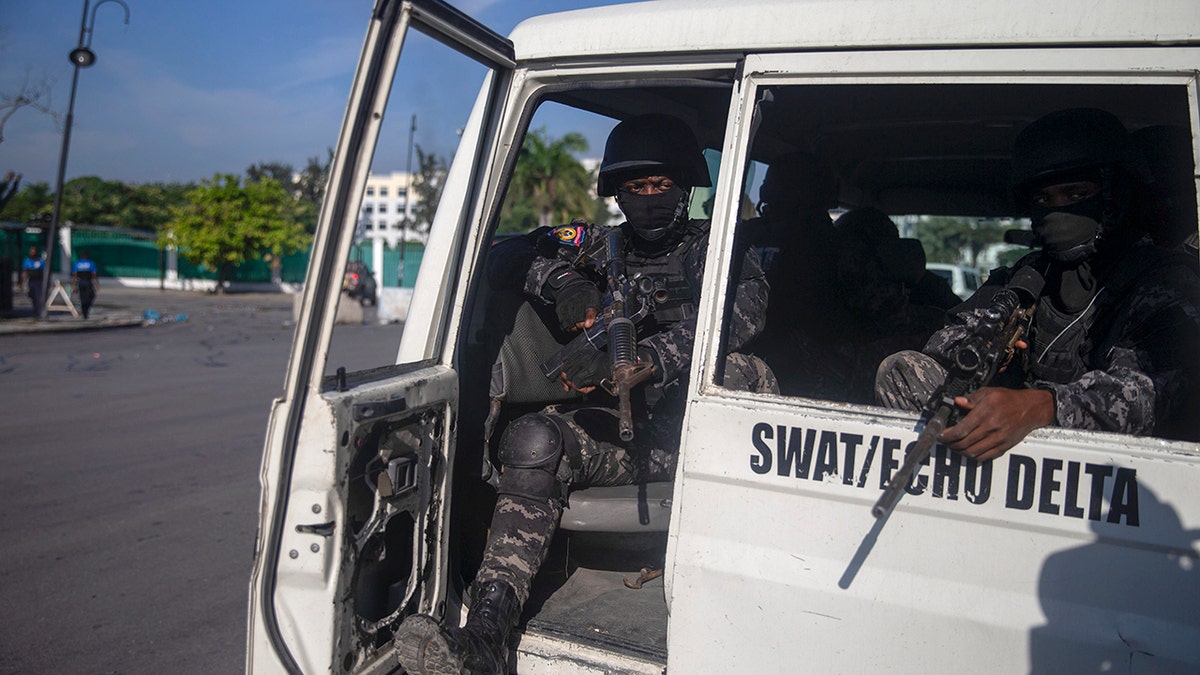Armed forces secure the area where the Haiti's Prime Minister Ariel Henry placed a bouquet of flowers in front of independence hero Jean Jacques Dessalines memorial in Port-au-Prince, Haiti on Sunday.
