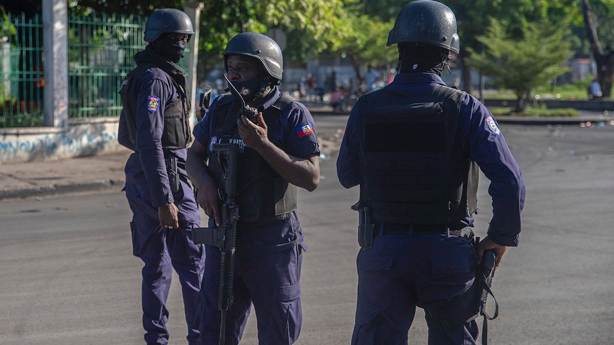 Armed forces secure the area where the Haiti's Prime Minister Ariel Henry placed a bouquet of flowers in front of independence hero Jean Jacques Dessalines memorial in Port-au-Prince, Haiti, on Sunday.