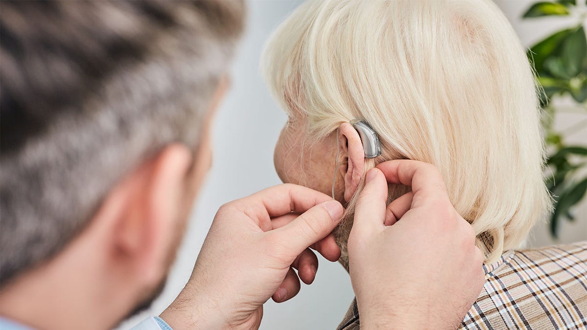 Woman with hearing aid