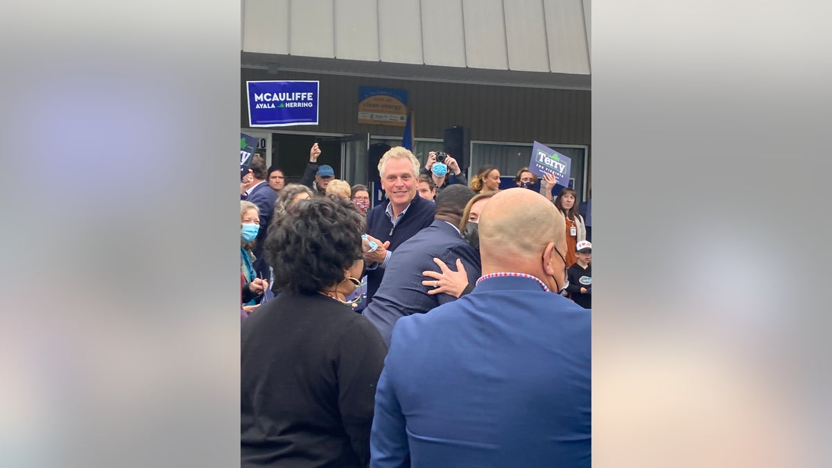 Virginia Democratic gubernatorial candidate Terry McAuliffe greets a handful of supporters outside the Virginia Democrats' regional headquarters in Harrisonburg, Virginia.