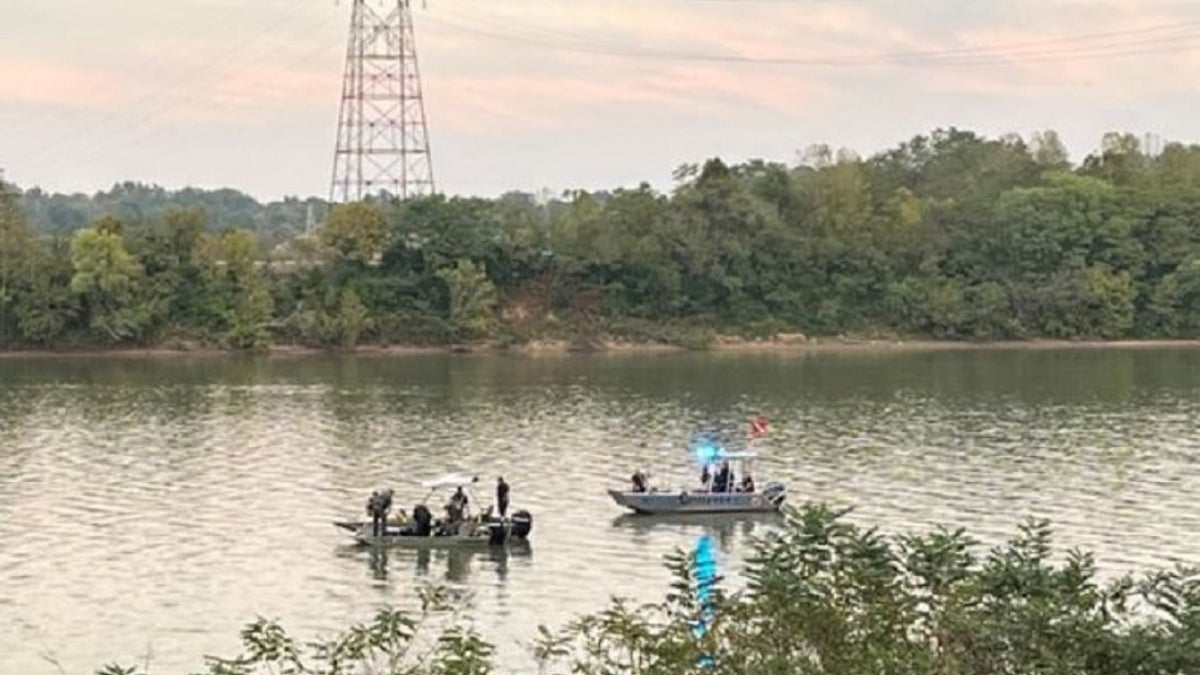 Human remains discovered last year inside a submerged SUV in an Indiana river have been identified as belonging to an Ohio woman who went missing two decades ago with her two children, authorities said Monday.