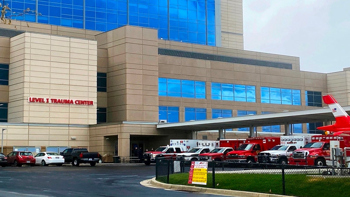 Ambulances line up at the entrance of the emergency room to drop off patients at Intermountain Medical Center in Murray, Utah, on Nov. 11 2020