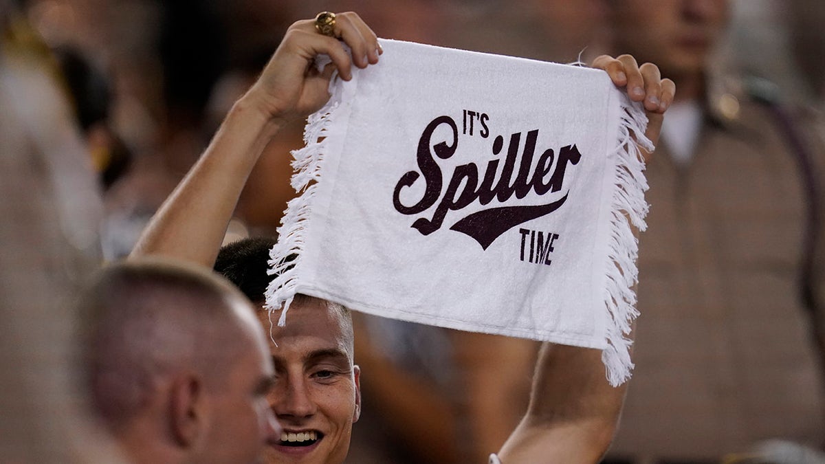 A member of the Texas A&amp;amp;M Corps of Cadets shows his support for Texas A&amp;amp;M running back Isaiah Spiller during the second half of an NCAA college football game against South Carolina, Saturday, Oct. 23, 2021, in College Station, Texas.
