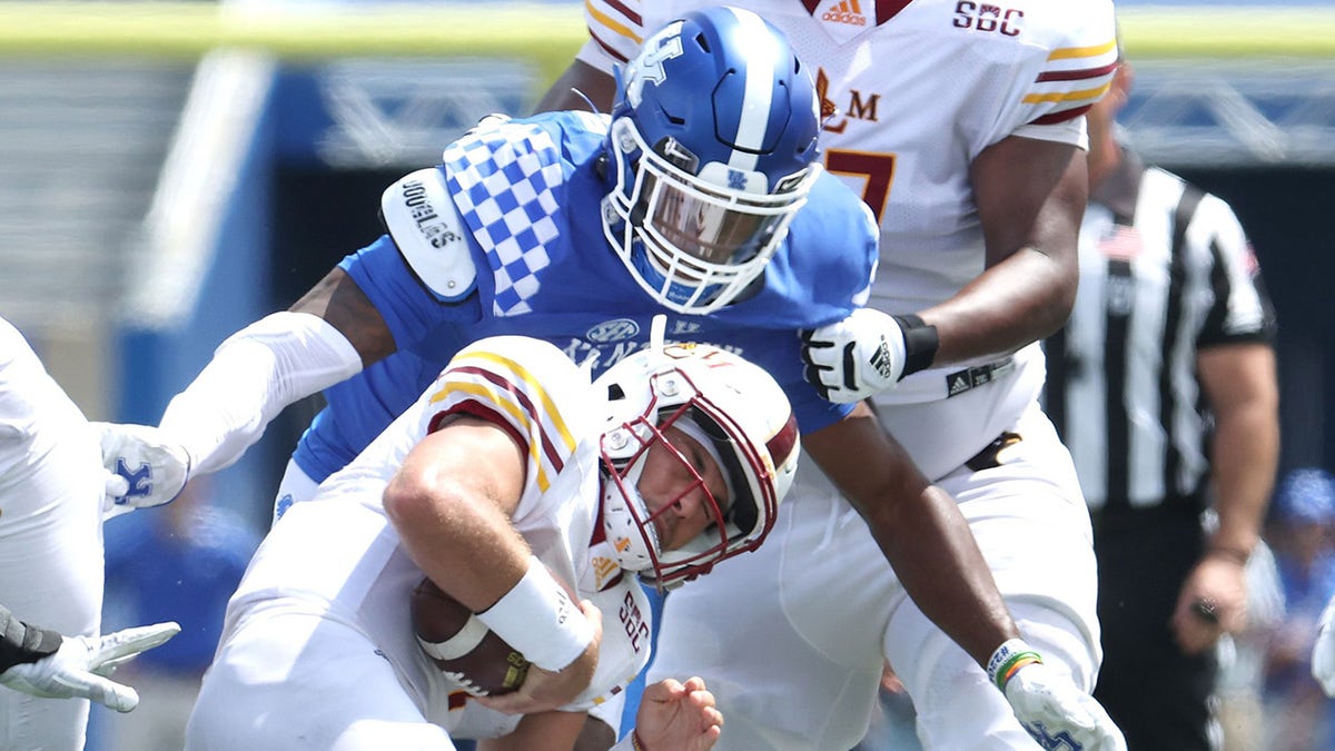 J.J. Weaver #13 of the Kentucky Wildcats sacks Rhett Rodriguez #4 of the ULM War Hawks at Kroger Field on Sept. 4, 2021 in Lexington, Kentucky.