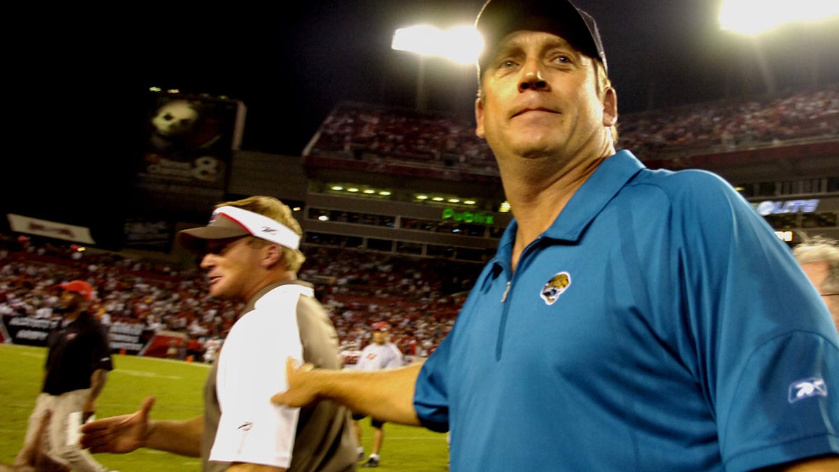 Coach Jack Del Rio of the Jacksonville Jaguars meets coach Jon Gruden of the Tampa Bay Buccaneers after play at Raymond James Stadium on Oct. 28, 2007, in Tampa, Florida. The Jaguars won 24-23.