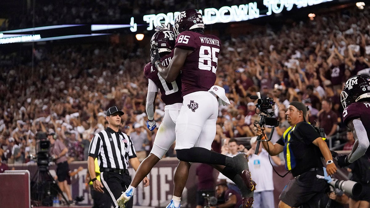 Texas A&M tight end Jalen Wydermyer (85) celebrates with wide receiver Ainias Smith (0) after scoring a touchdown agent Alabama during the first half of an NCAA college football game Saturday, Oct. 9, 2021, in College Station, Texas.