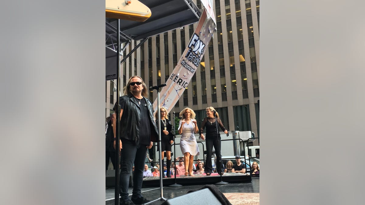 Janice Dean performs with Lynyrd Skynard.