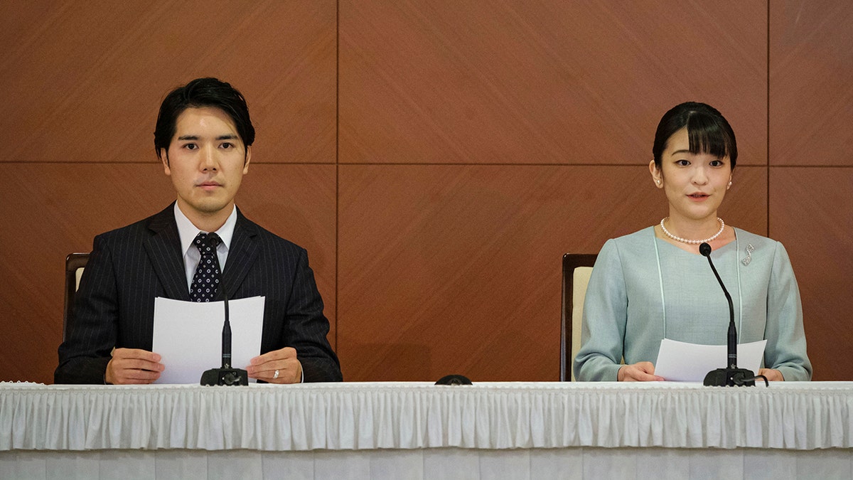 Japan's former Princess Mako, right, the elder daughter of Crown Prince Akishino and Crown Princess Kiko, and her husband, Kei Komuro, attend a press conference to announce their marriage, at a hotel in Tokyo, Japan on Tuesday.