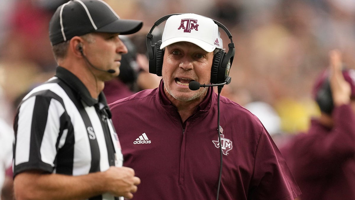 In this Saturday, Sept. 11, 2021 file photo, Texas A&M head coach Jimbo Fisher argues with a referee in the second half of an NCAA college football game against Colorado in Denver. Texas A&M plays Arkansas on Saturday, Sept. 25, 2021.