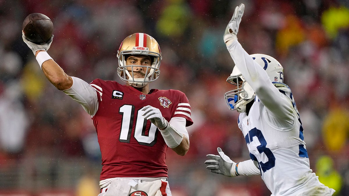 San Francisco 49ers quarterback Jimmy Garoppolo (10) passes against Indianapolis Colts outside linebacker Darius Leonard during the first half of an NFL football game in Santa Clara, Calif., Sunday, Oct. 24, 2021.