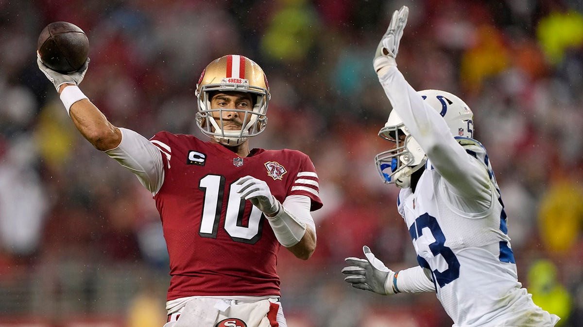 San Francisco 49ers quarterback Jimmy Garoppolo (10) passes against Indianapolis Colts outside linebacker Darius Leonard during the first half of an NFL football game in Santa Clara, Calif., Sunday, Oct. 24, 2021.