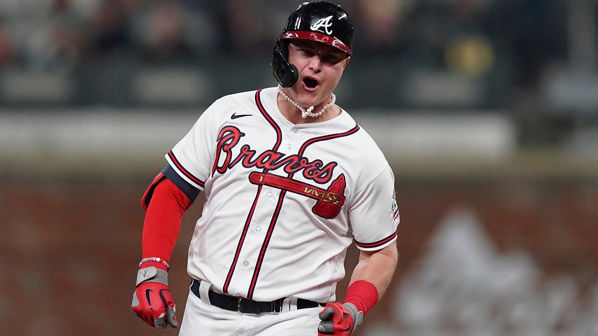 Atlanta Braves' Joc Pederson celebrates after hitting a two-run home run during the fourth inning in Game 2 of baseball's National League Championship Series against the Los Angeles Dodgers Sunday, Oct. 17, 2021, in Atlanta.
