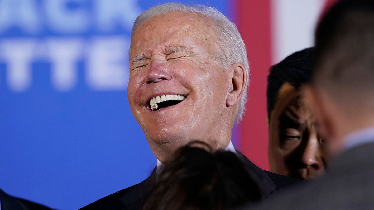 President Joe Biden laughs as he greets people after speaking about his infrastructure plan and his domestic agenda during a visit to the Electric City Trolley Museum in Scranton, Pa., Wednesday, Oct. 20, 2021. (AP Photo/Susan Walsh)