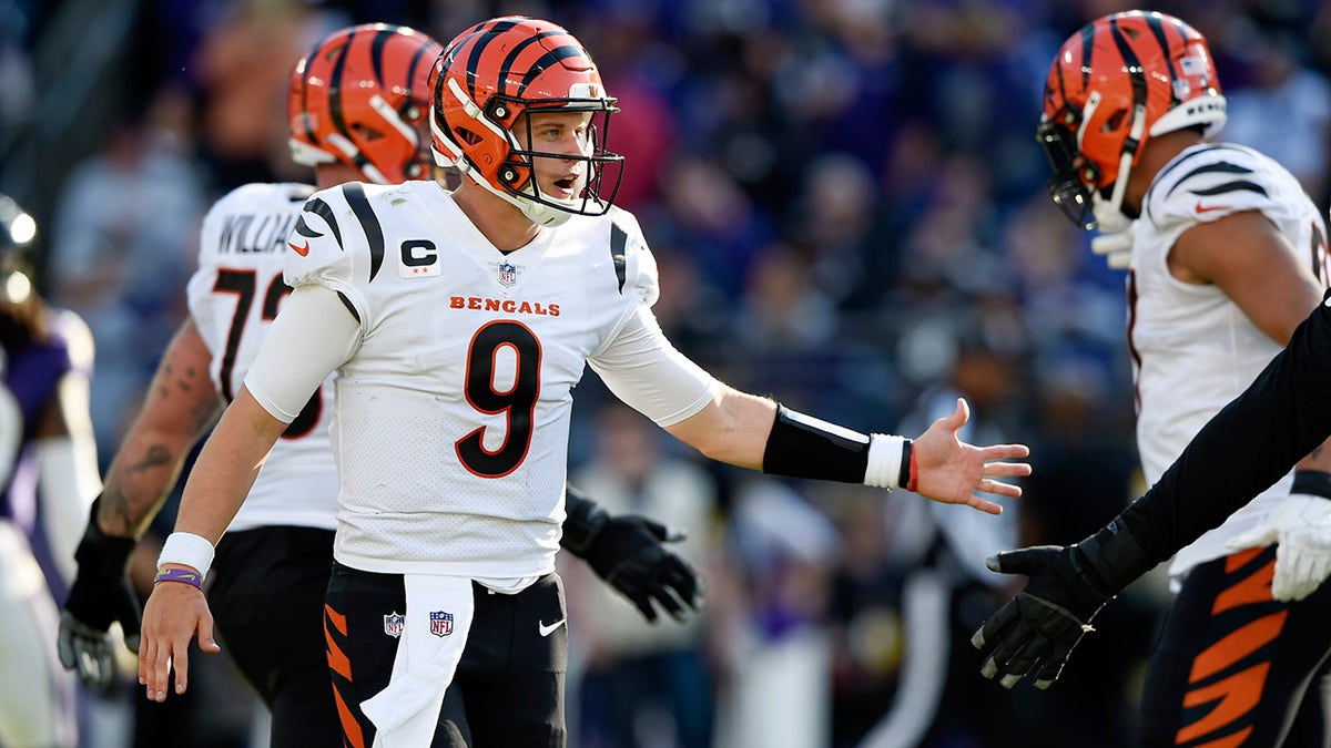 Cincinnati Bengals quarterback Joe Burrow reacts after running back Joe Mixon scored on a touchdown run against the Baltimore Ravens during the second half of an NFL football game, Sunday, Oct. 24, 2021, in Baltimore.